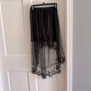 Stretchy black mini skirt with hi lo mesh overlay